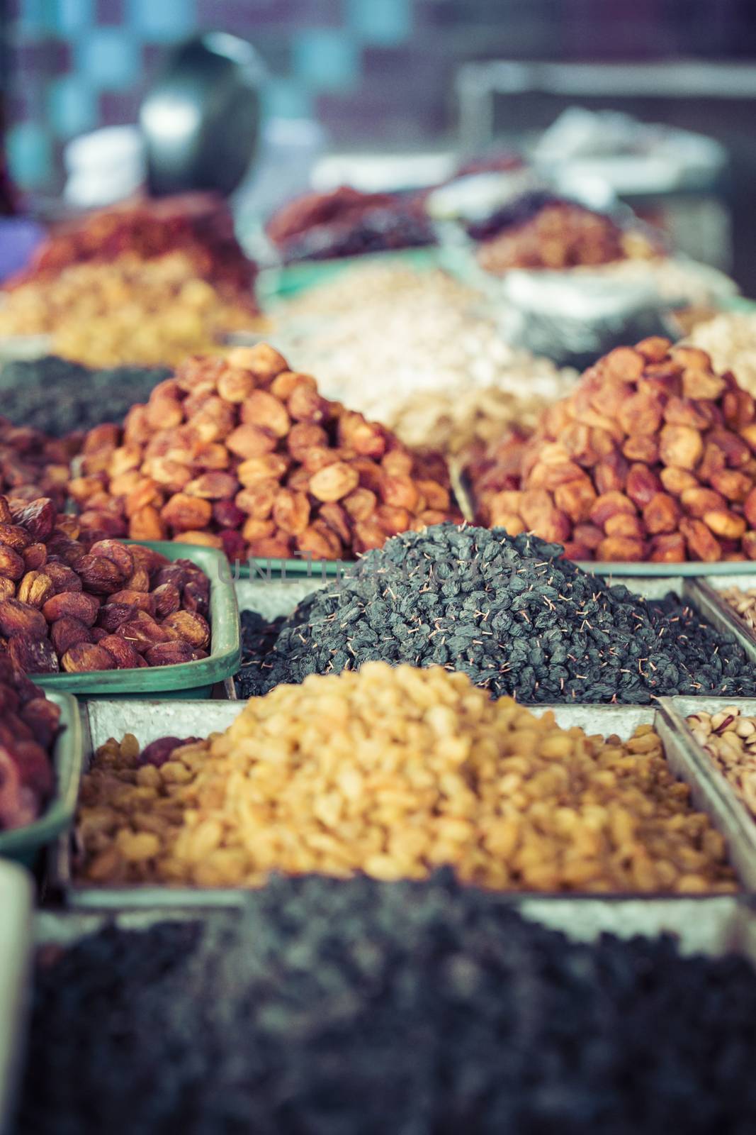 Dry fruits and spices like cashews, raisins, cloves, anise, etc. on display for sale in a bazaar in Osh Kyrgyzstan.