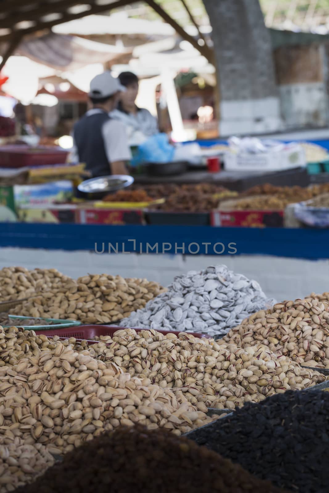 Spices and vegetables in bags at local bazaar in Osh. Kyrgyzstan.