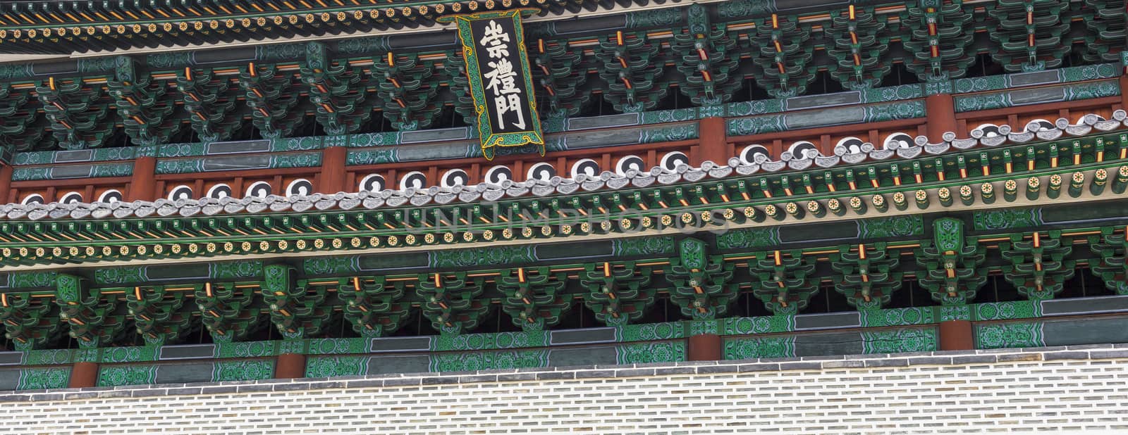 Detail of Traditional Korean Roof, Colourful Decorated Ornament for Ancient Korean Palace or Temple at Seoul, South Korea.