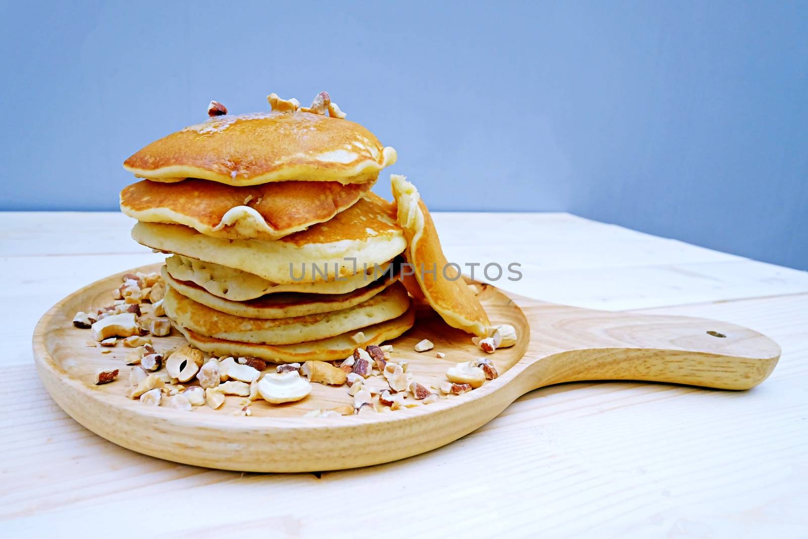 Pancakes with Almonds  in dish on Table wood