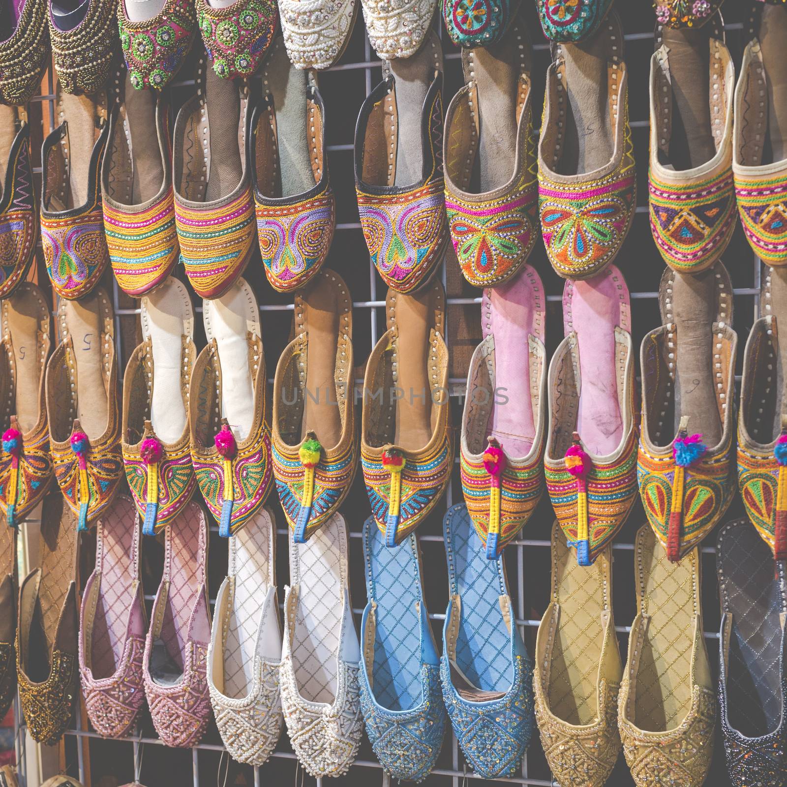 Rows of typically oriental shoes at the market in Dubai by mariusz_prusaczyk