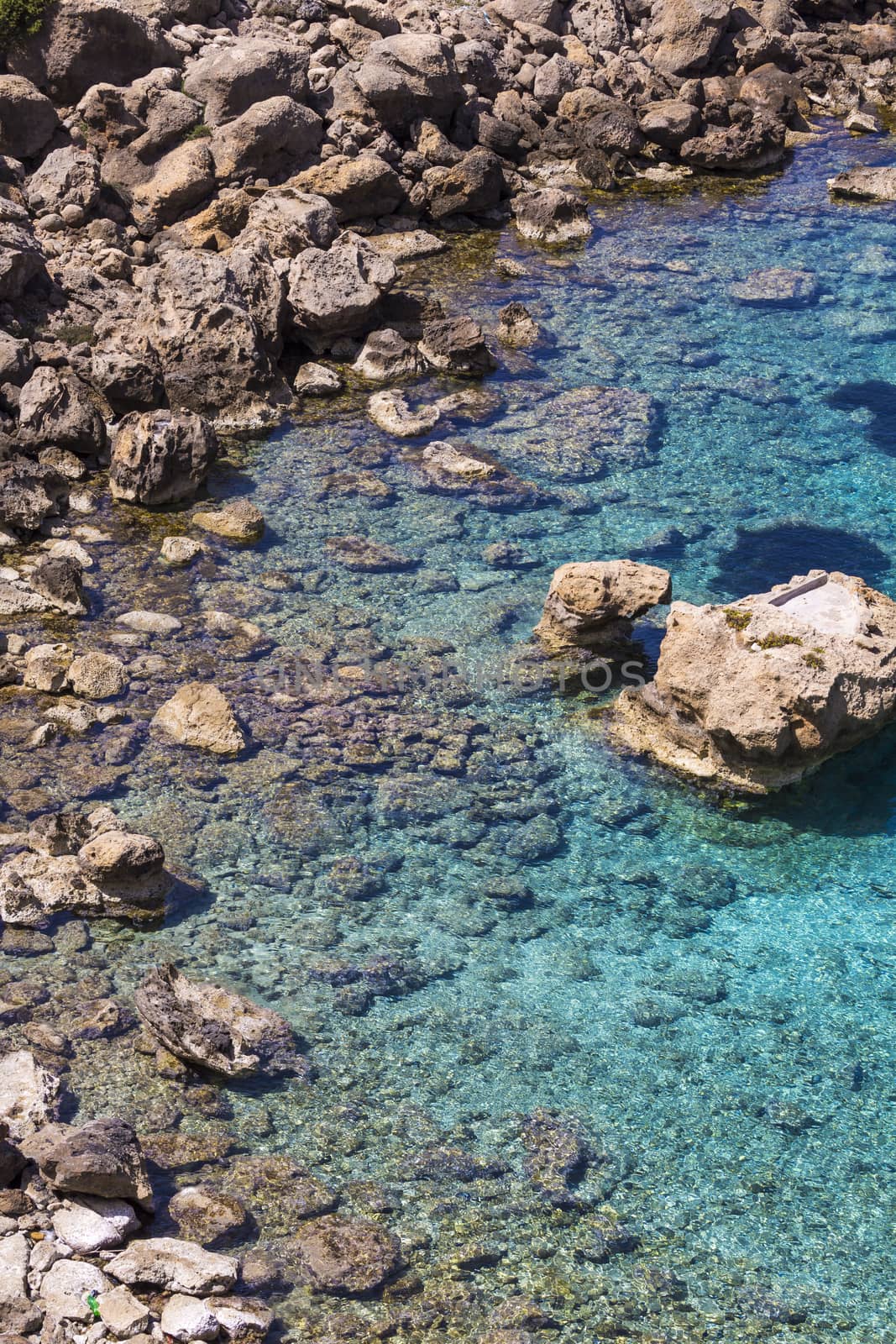 Beautiful Deep blue sea and rocks in Greece by mariusz_prusaczyk