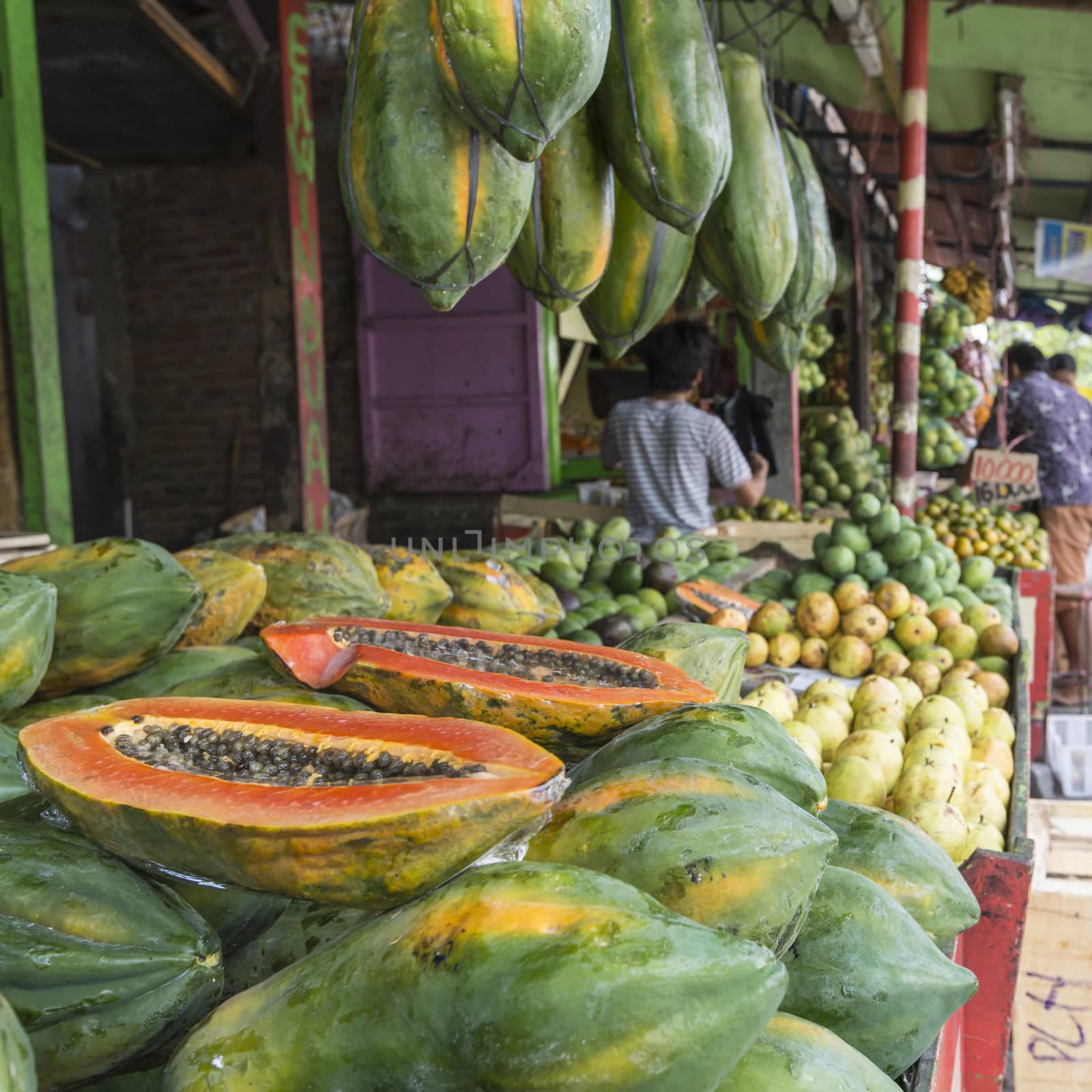 Papaya at tropical market in Yogjakarta, Indonesia. by mariusz_prusaczyk