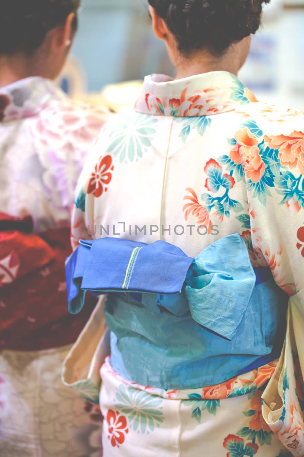 Japanese women wear a traditional dress called Kimono for Sakura viewing at Kiyomizu temple in Kyoto 