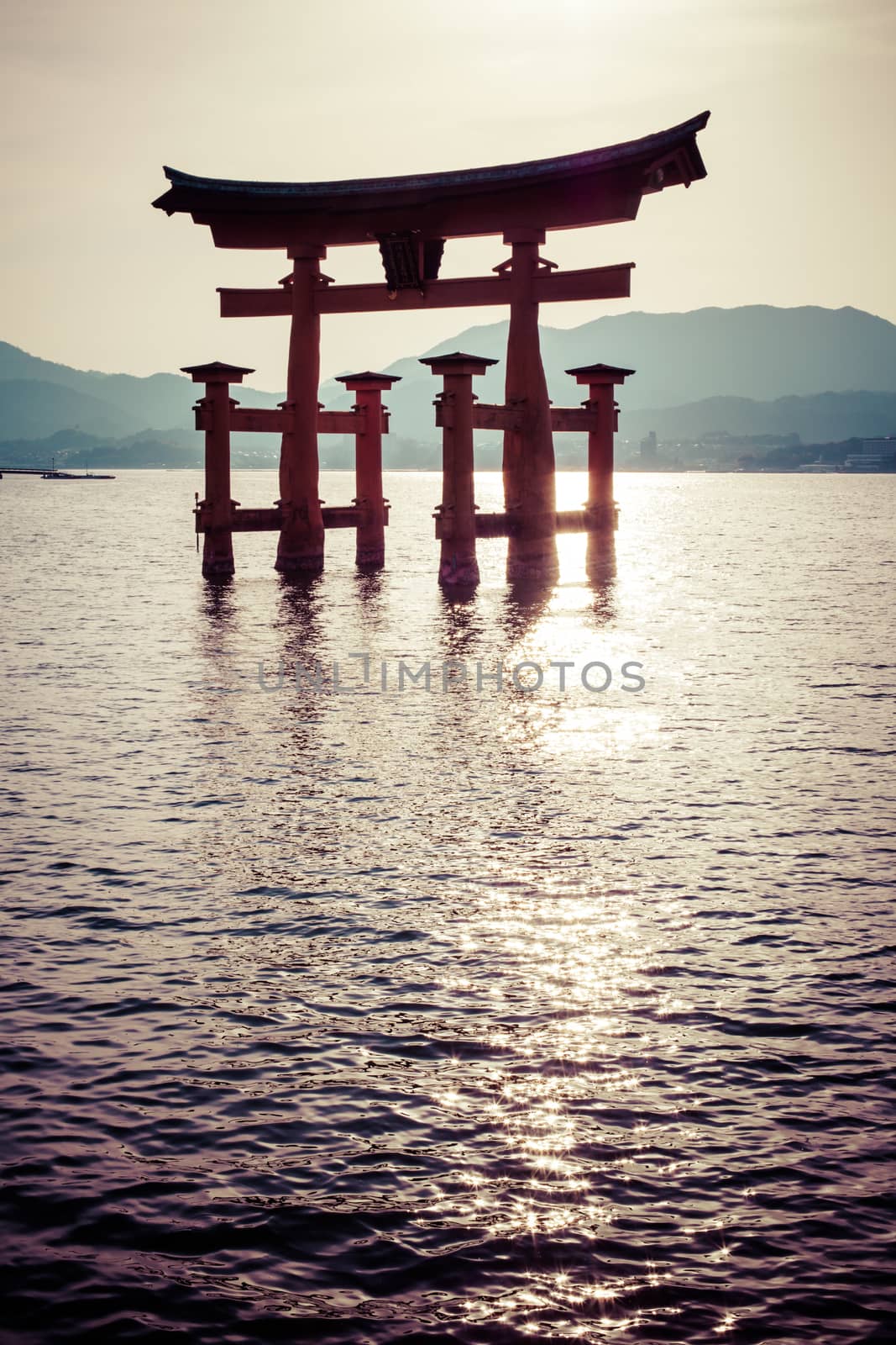 Miyajima, Famous big Shinto torii standing in the ocean in Hiroshima, Japan  by mariusz_prusaczyk