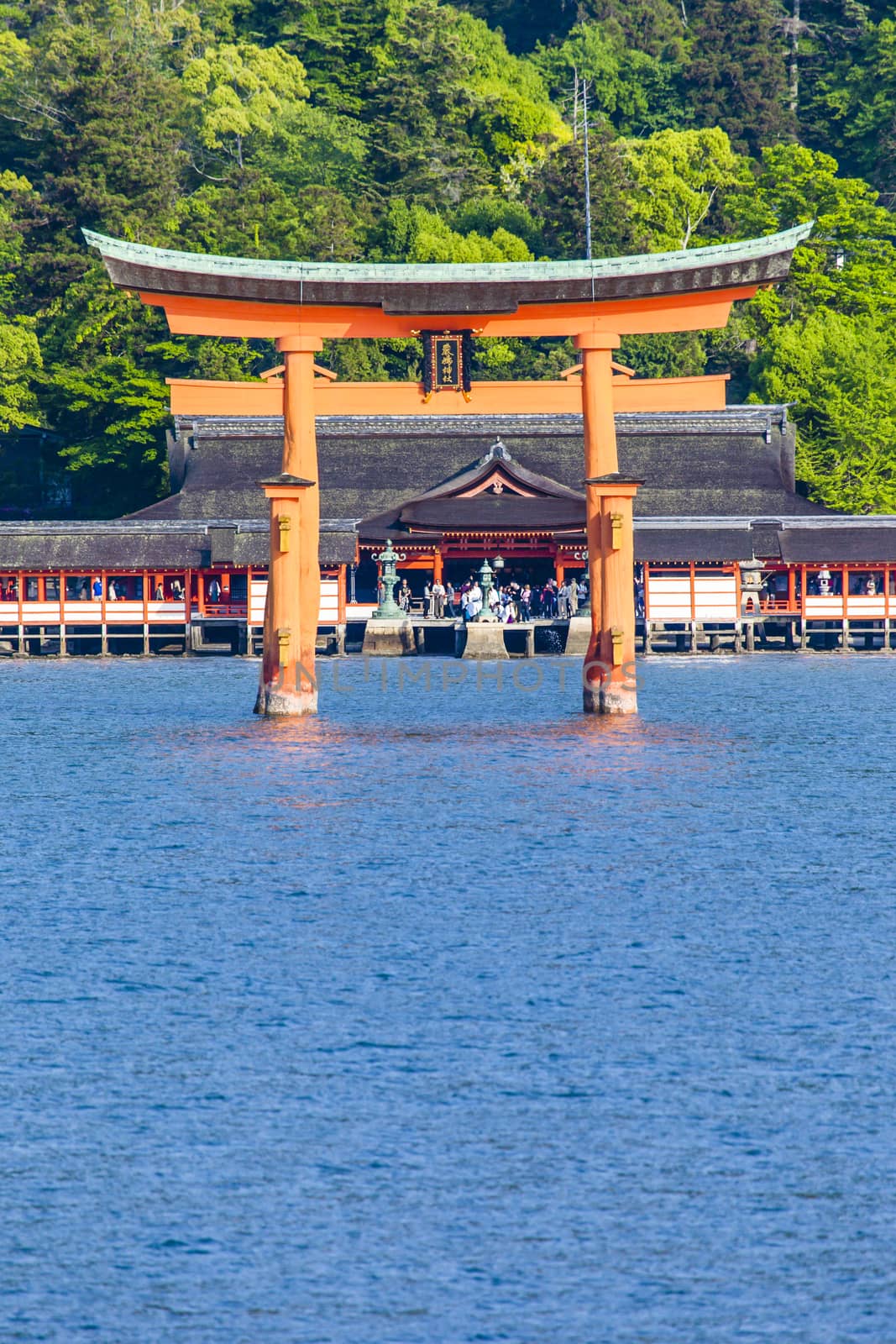 Miyajima, Famous big Shinto torii standing in the ocean in Hiroshima, Japan  by mariusz_prusaczyk