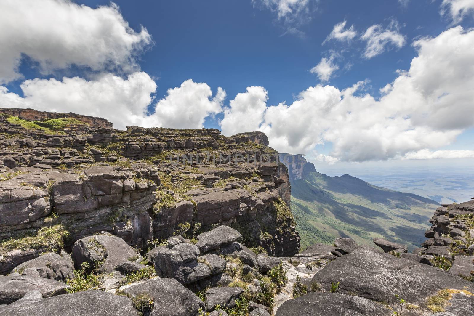 Trail down from the plateau Roraima passes under a falls - Venezuela, South America

