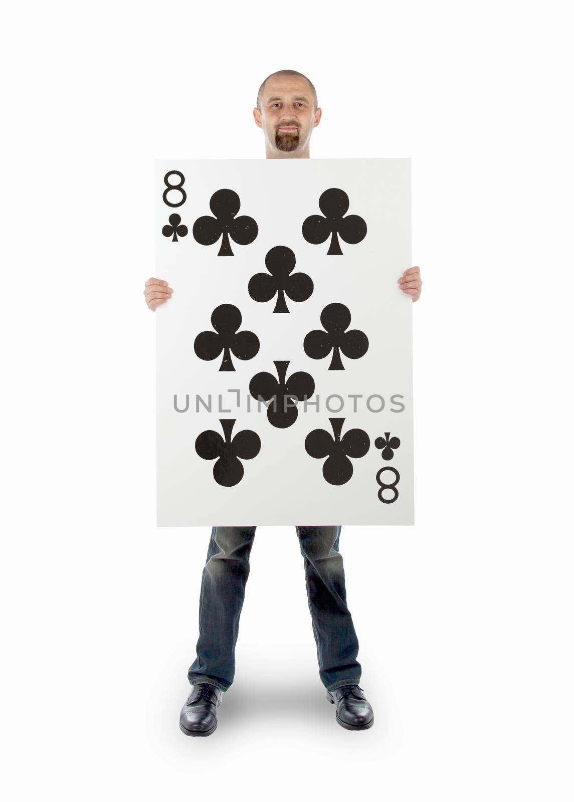Businessman with large playing card - Eight of clubs