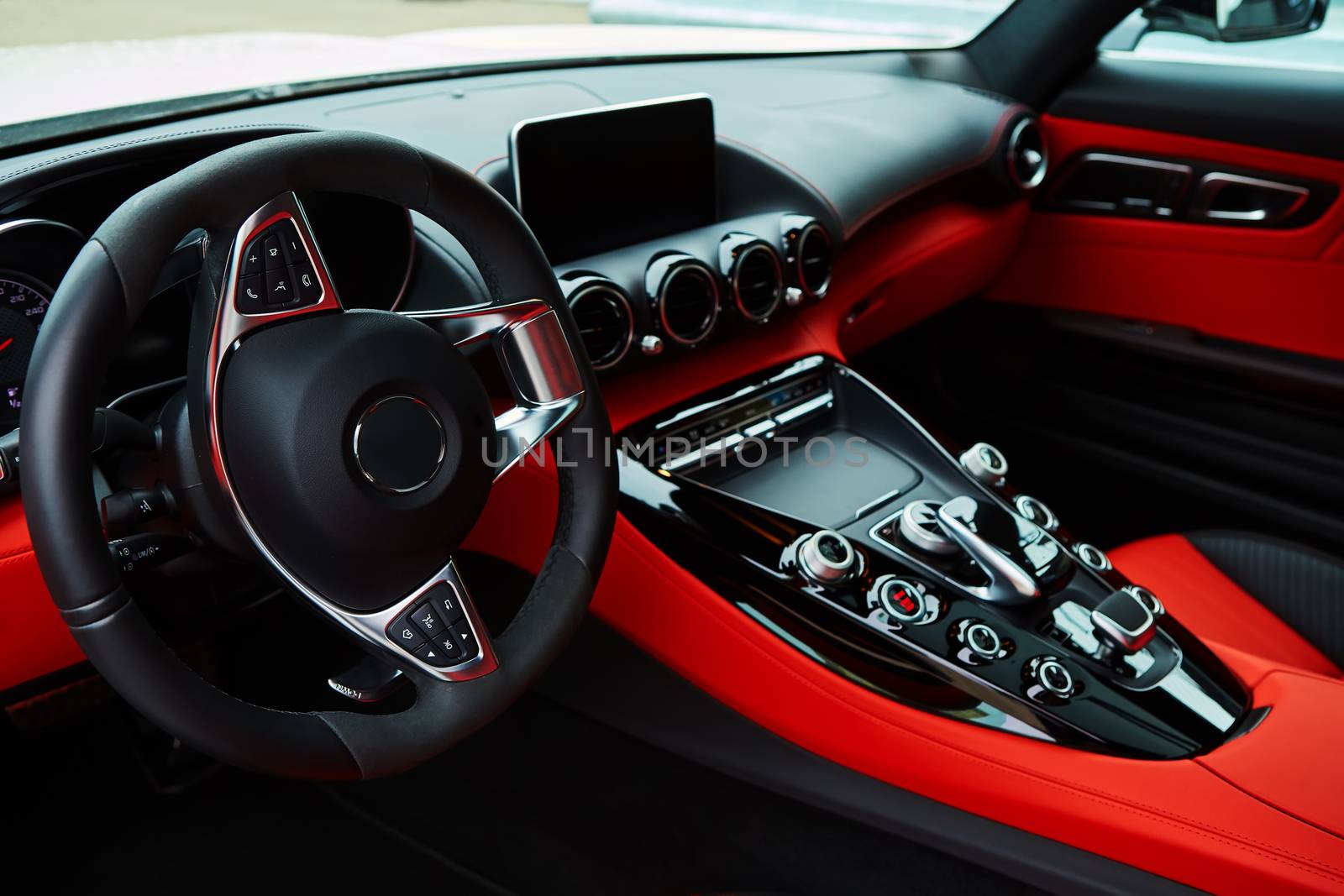 Luxury car Interior. Steering wheel and dashboard
