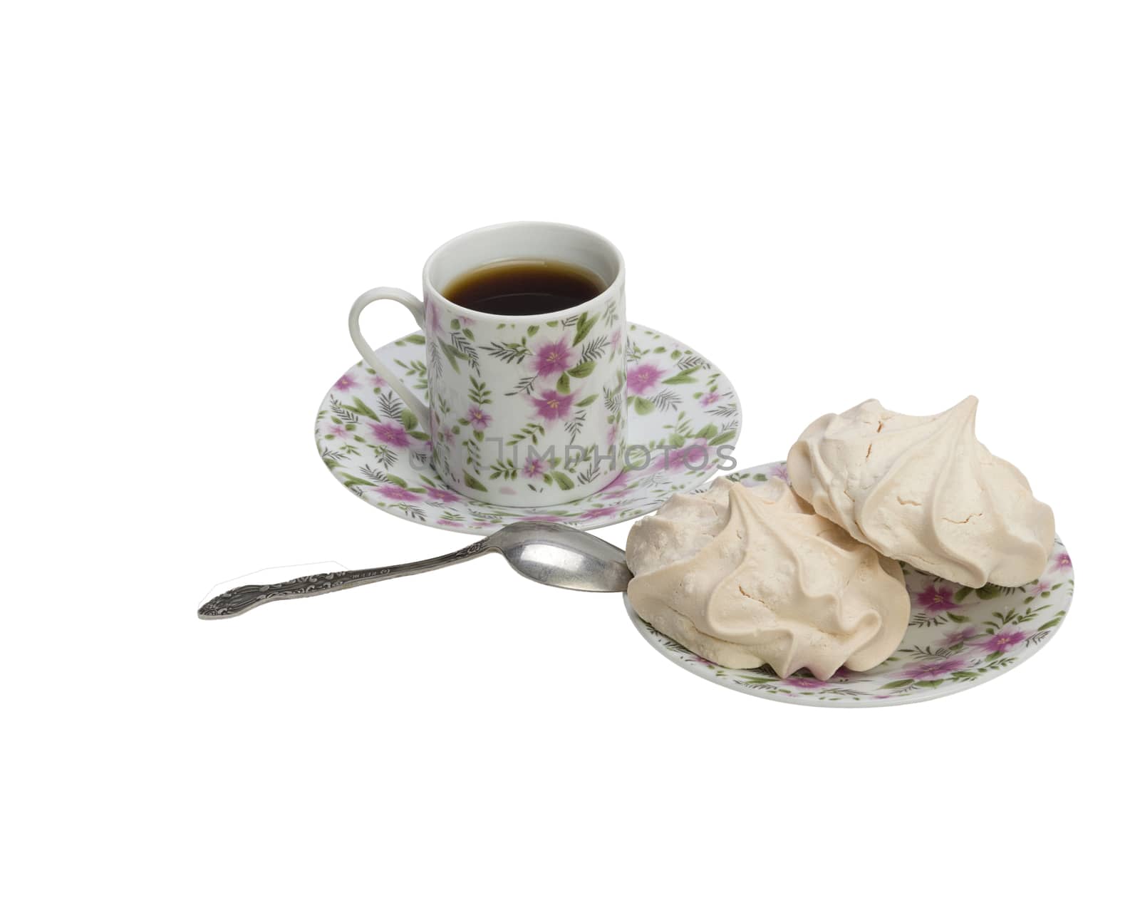 Fresh delicious meringue cookies served with tea or coffee macro