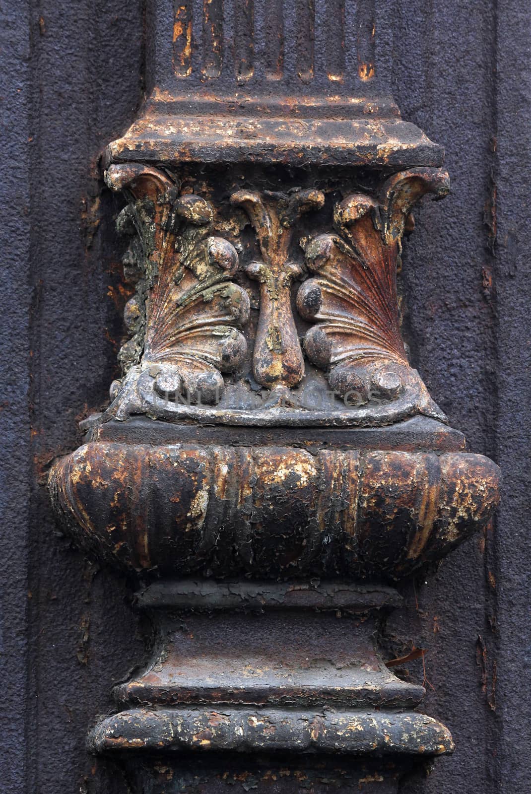 weathered tombstone decorations divided.