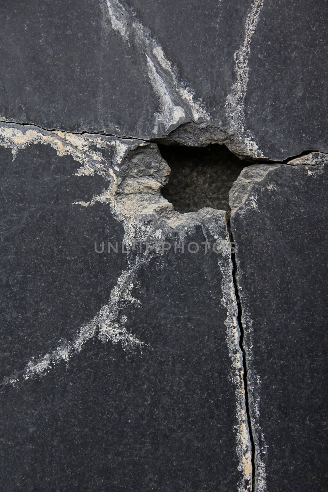 Fracture crack black marble surface.