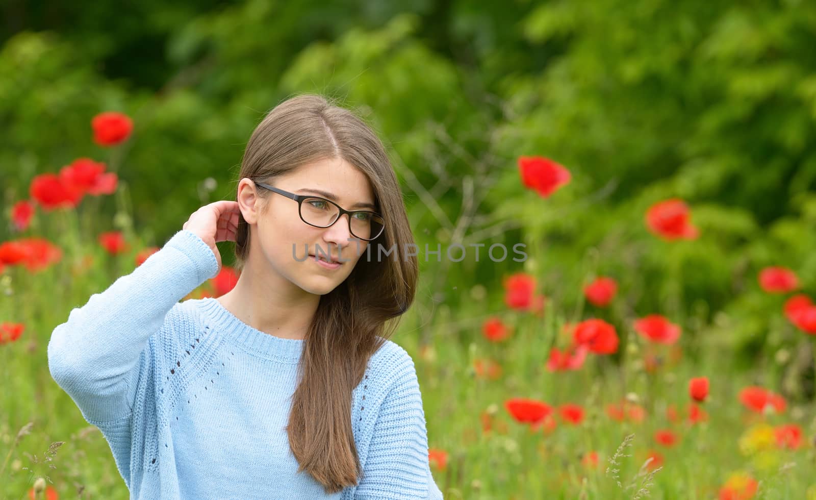 Young girl in the poppy field by mady70