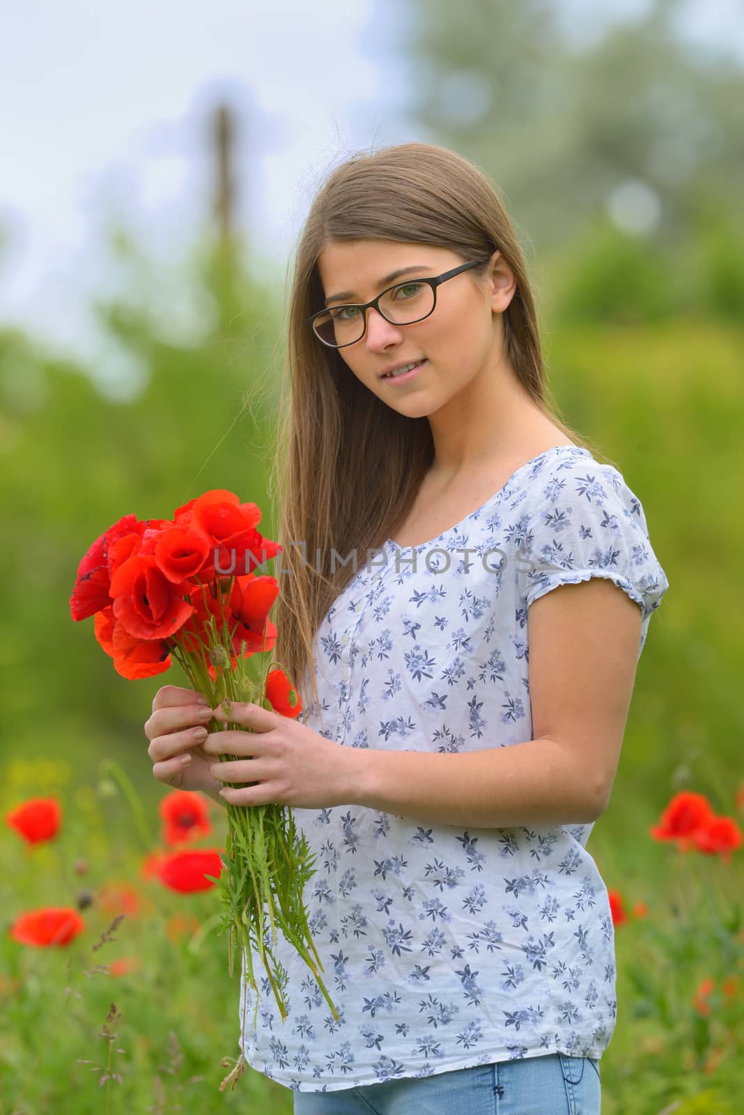 Young girl in the poppy field by mady70