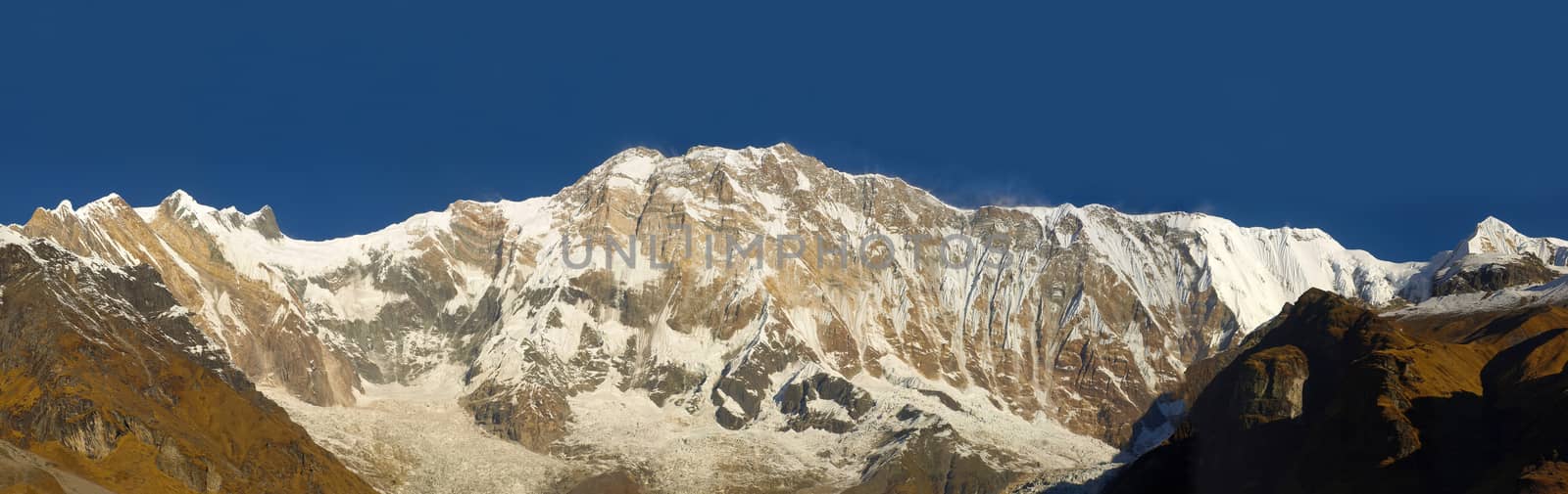 Panorama of the south face of Annapurna I Main Mountain on the background of sky in morning in the Himalayas
