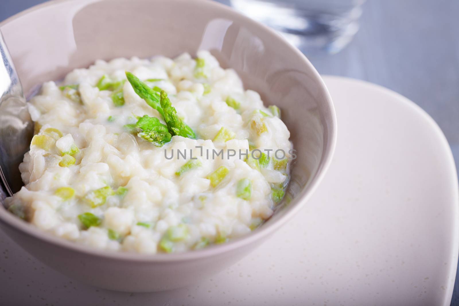 Risotto with Asparagus served in a white plate