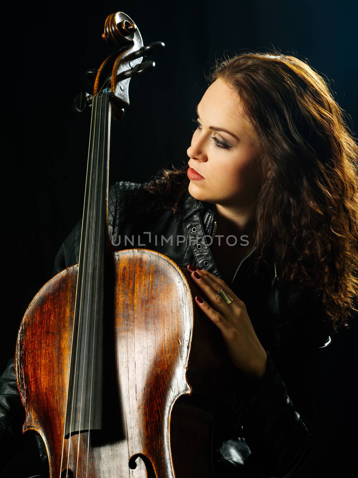 Cello player and her instrument by sumners