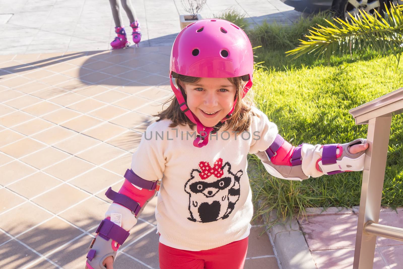 Little girl smiling having fun skating by max8xam