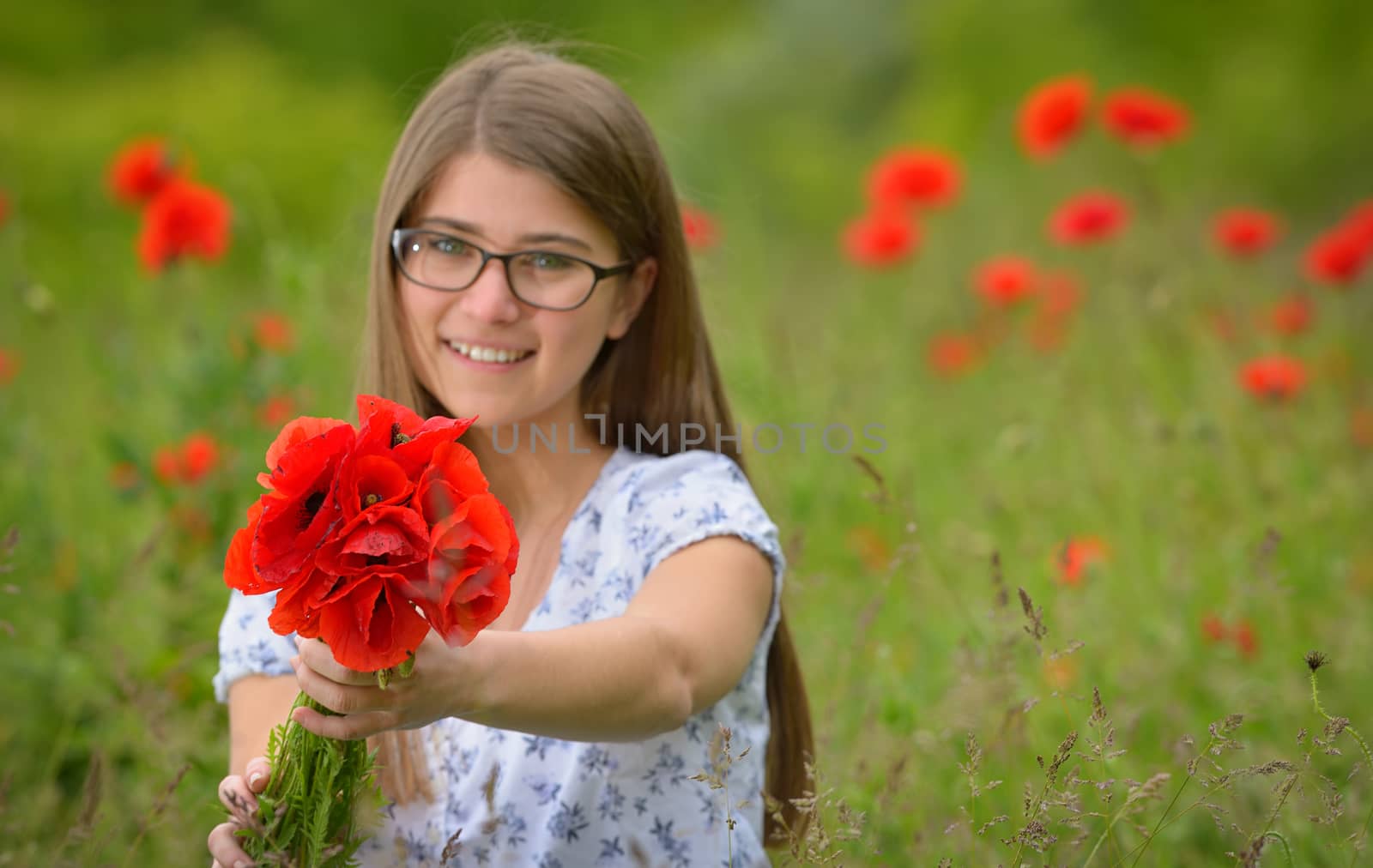 Young girl in a poppy field by jordachelr