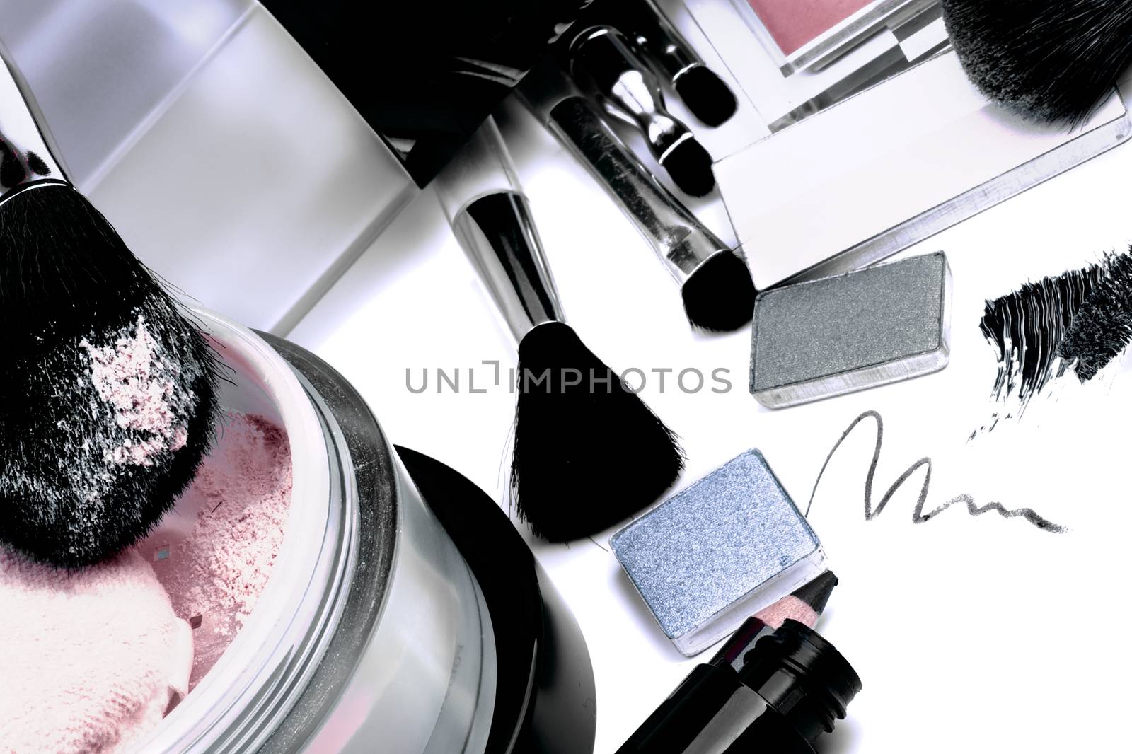 Arrangement of Make up Products with Eyeshadow, Moisturizer, Mascara, Blush, Face Powder and Personal Accessory closeup on White background