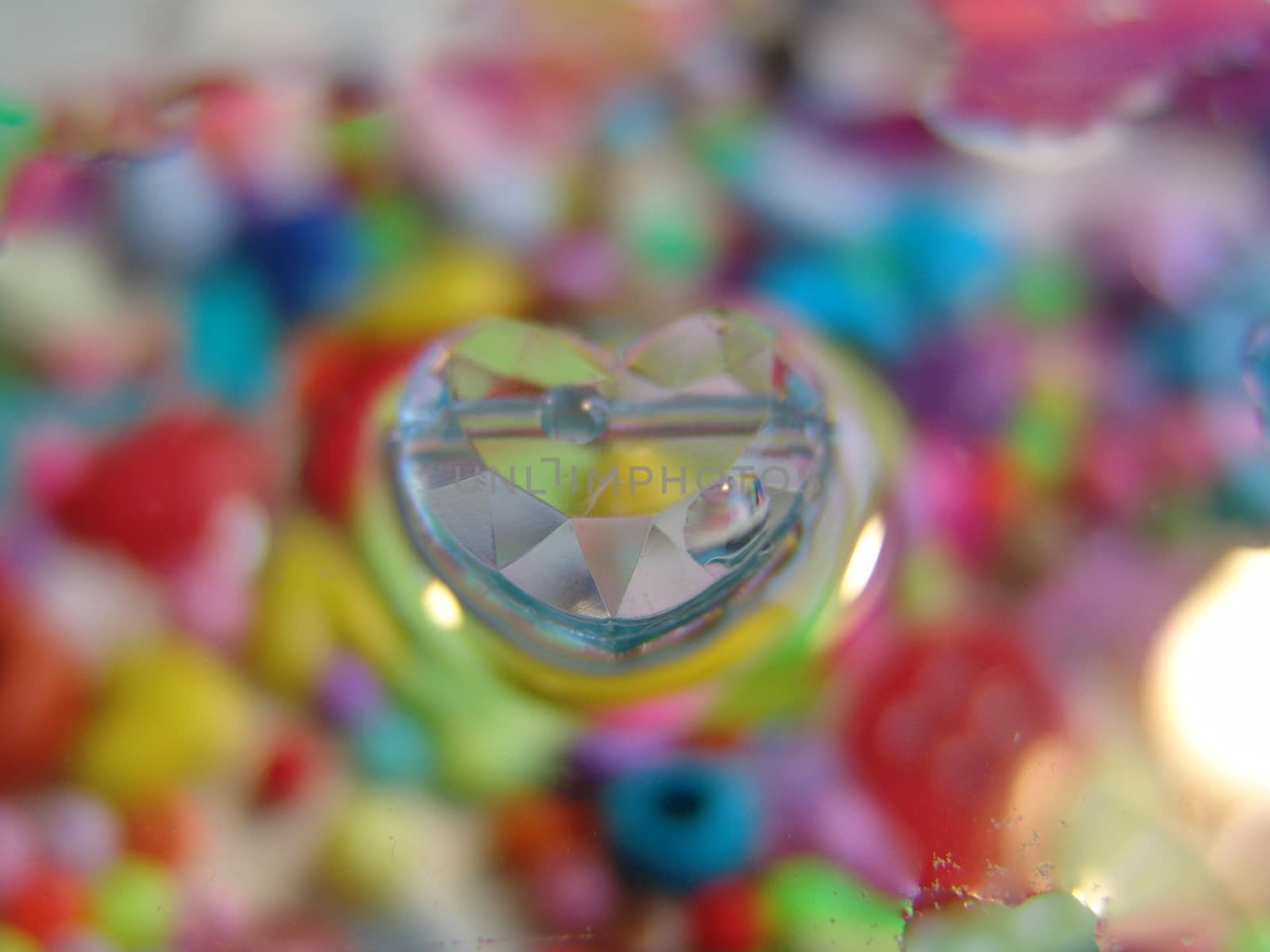 water drops on multicolor background.glass heart