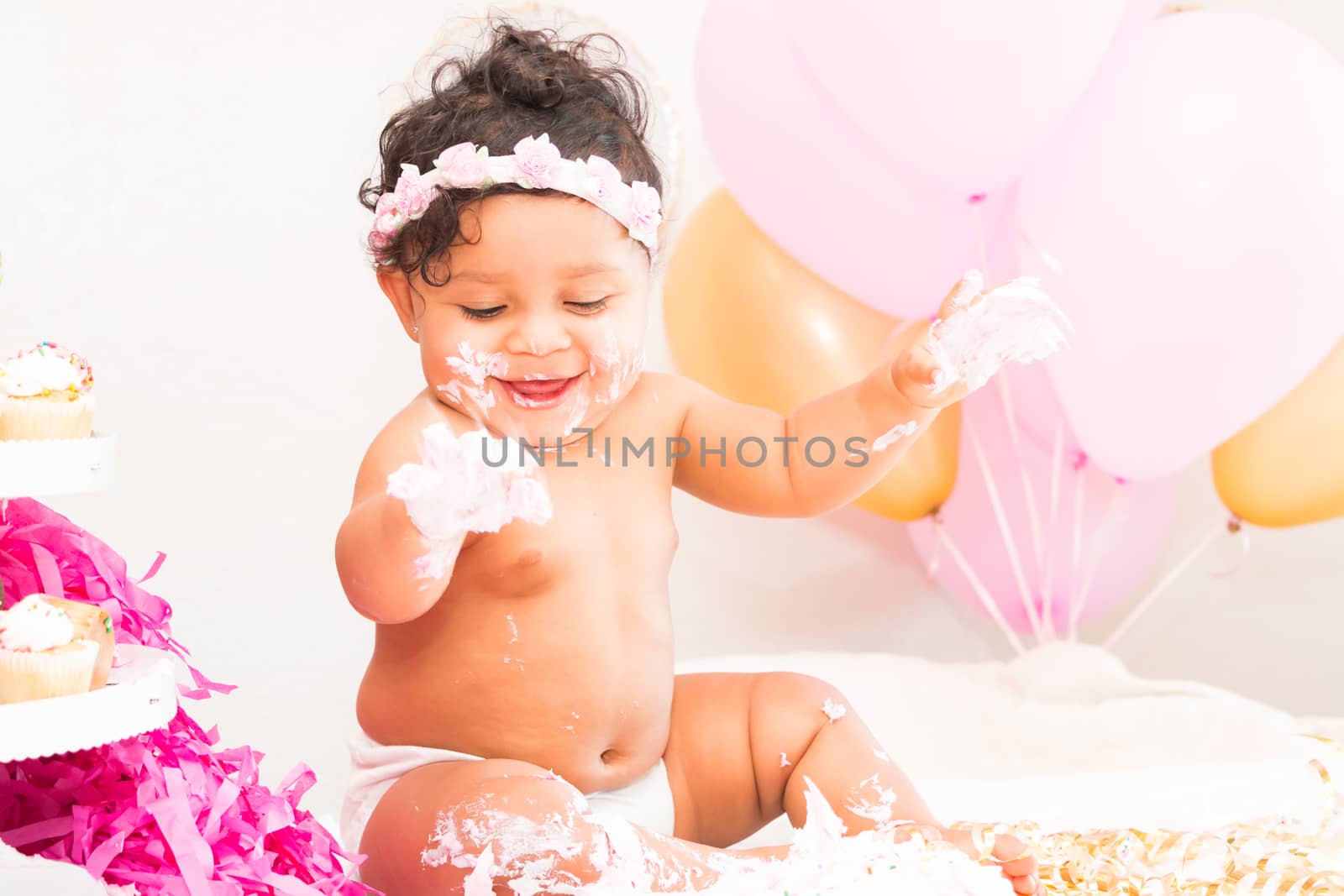 Young Baby Girl Celebrating Her First Birthday With Cake