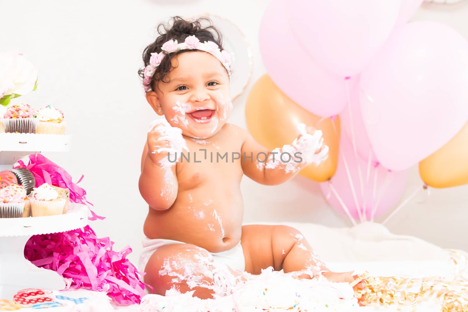 Young Baby Girl Celebrating Her First Birthday With Cake