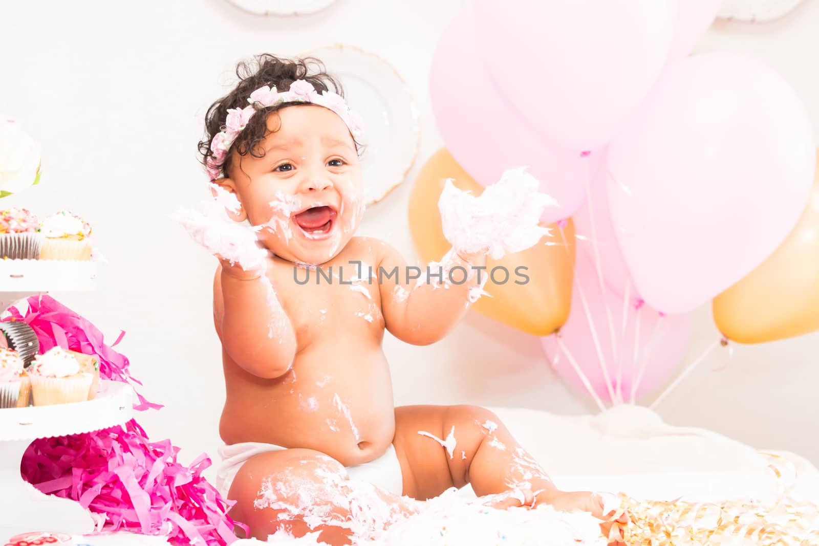 Young Baby Girl Celebrating Her First Birthday With Cake