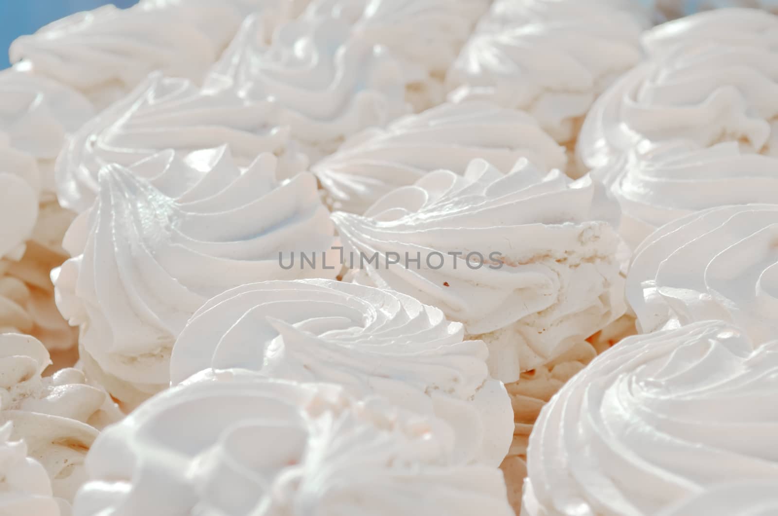 Many white aerial cakes, meringue and marshmallows