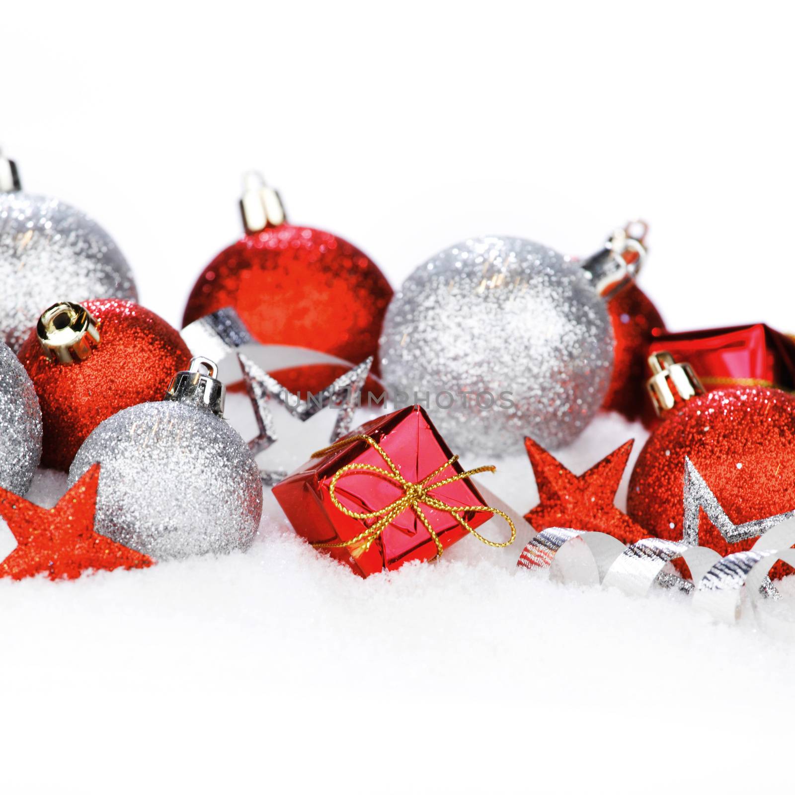 Christmas card with beautiful red and silver decorations in snow