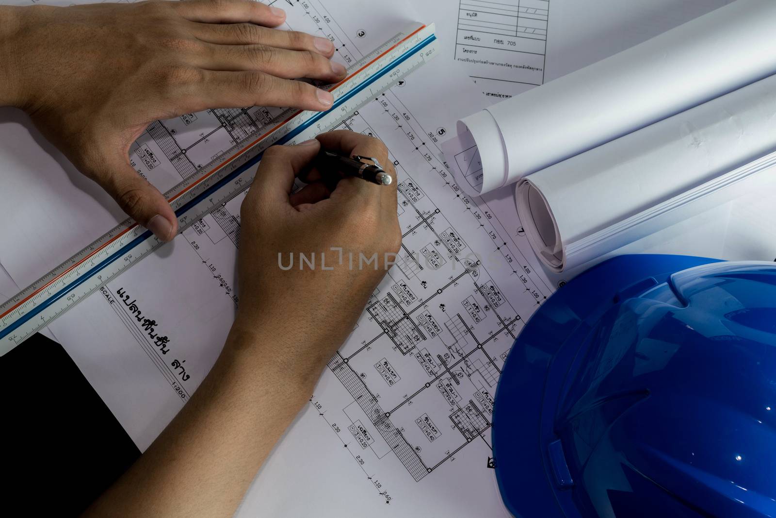 Workplace of architect - Architect rolls and plans.architectural plan,technical project drawing. Engineering tools view from the top. Construction background