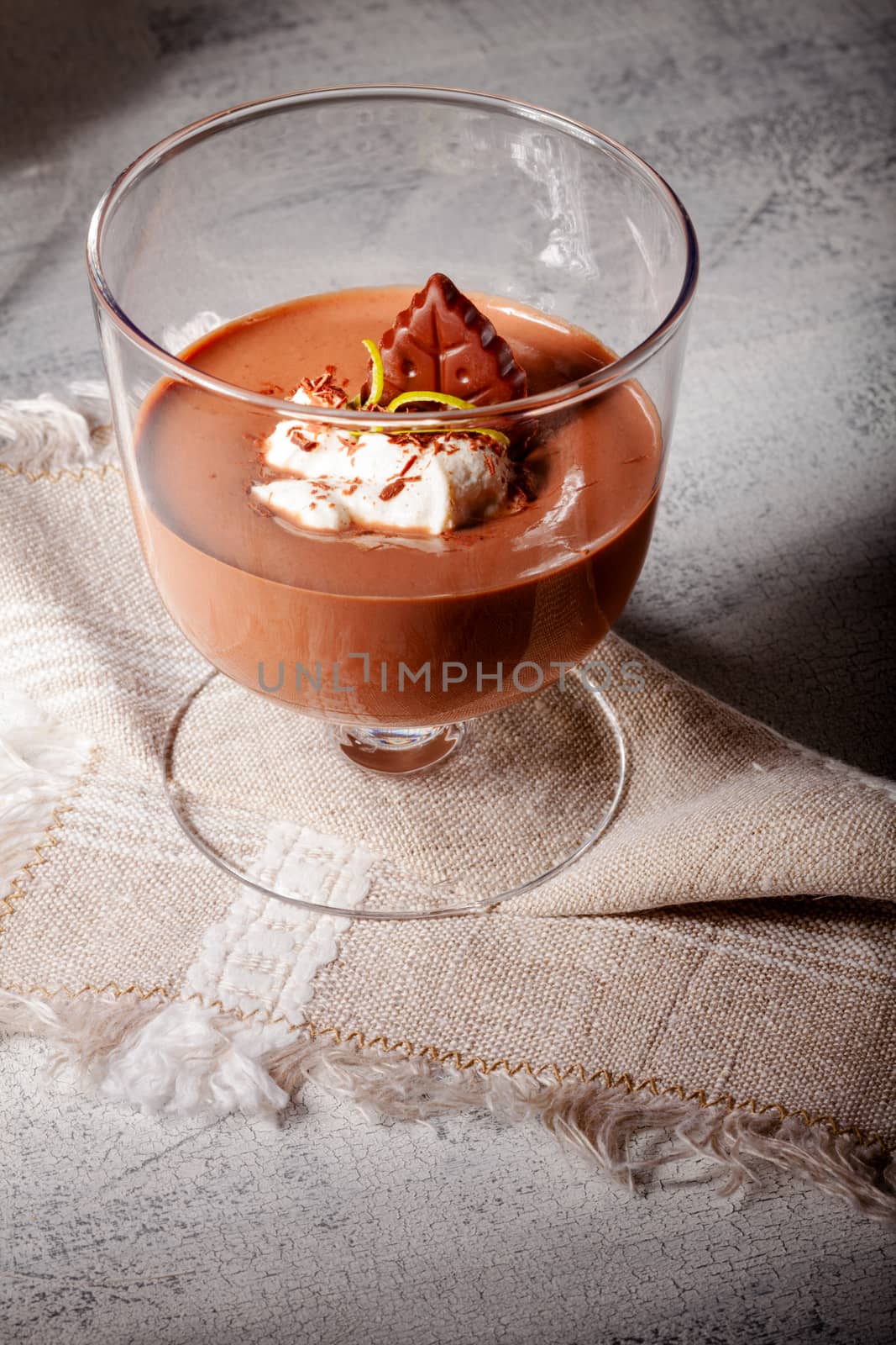 Glass with Chocolate Mousse Dessert served on a wooden surface