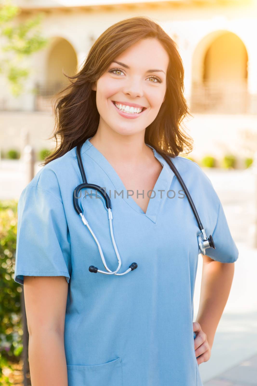 Portrait of Young Adult Female Doctor or Nurse Wearing Scrubs an by Feverpitched
