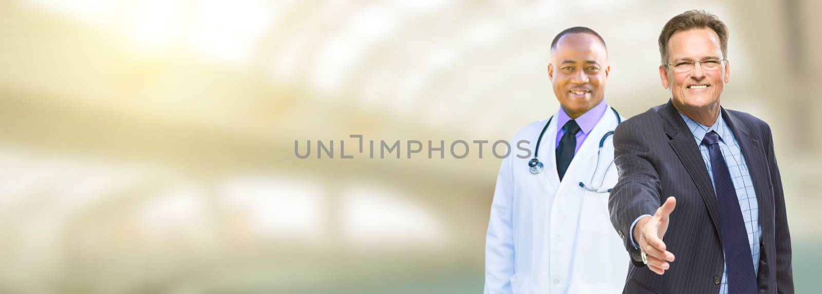 Caucasian Businessman and African American Male Doctor, Nurse or Pharmacist with Room For Text.