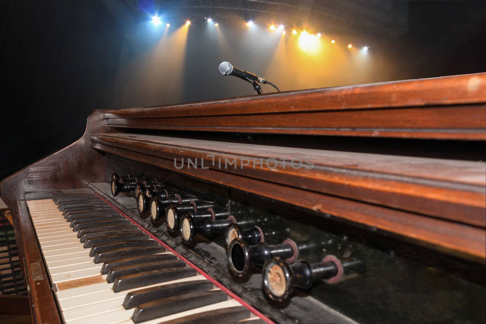 Old keys music instrument at a concert with focus on the foreground, background out of focus.