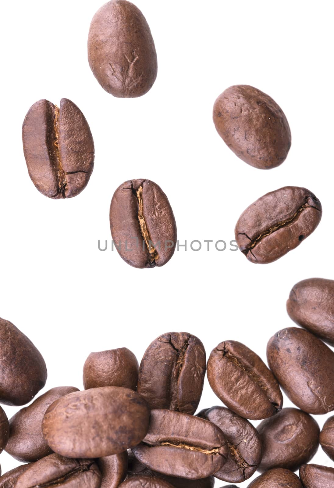 Closeup of coffee beans isolated on white background.