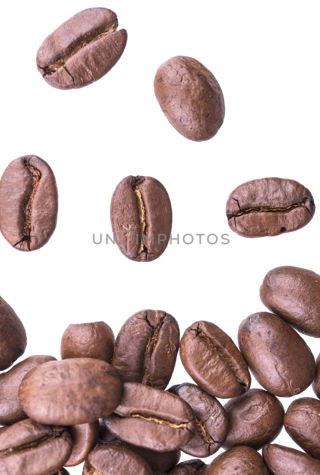 Closeup of coffee beans isolated on white background.