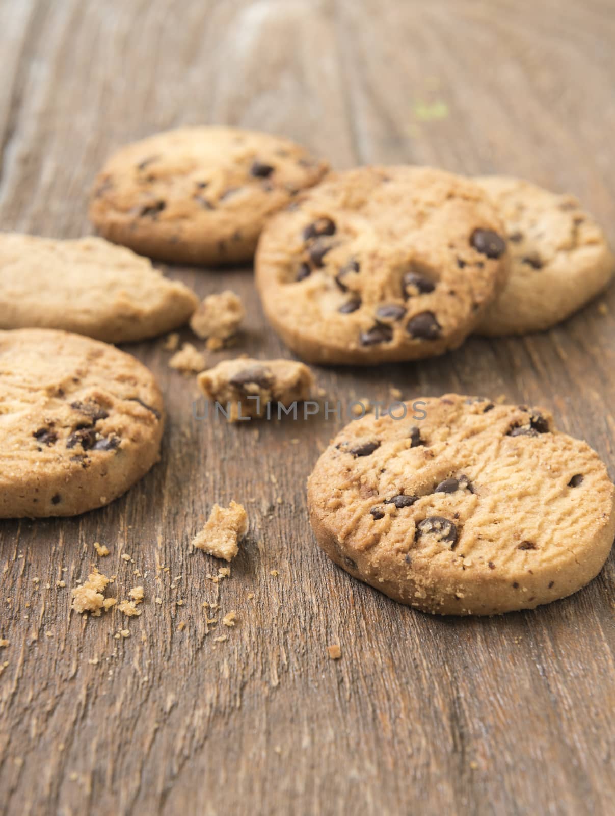 Cookies chocolate or chocolate chips on a wooden table.