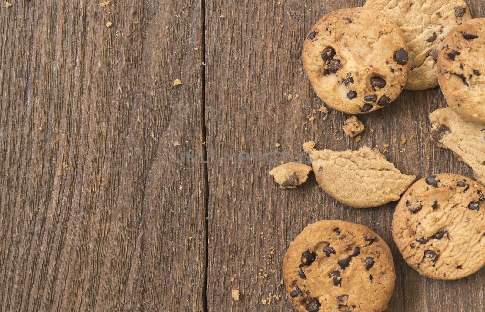 Cookies chocolate or chocolate chips on a wooden table.