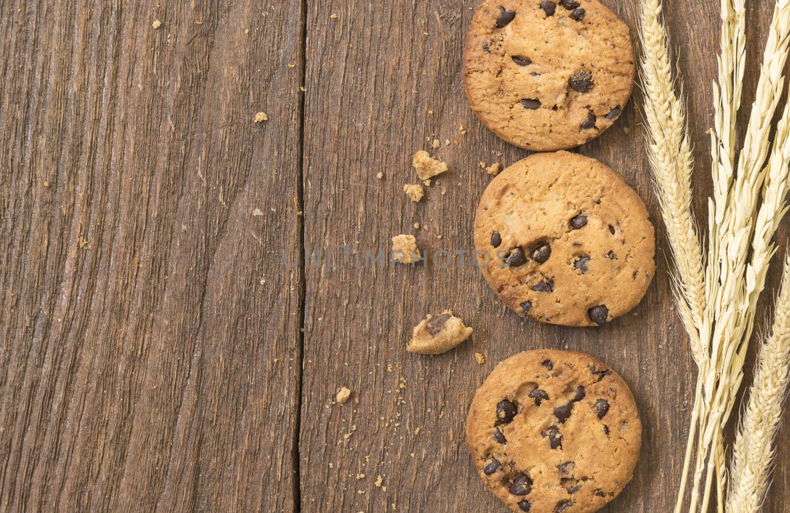 Cookies chocolate or chocolate chips on a wooden table.