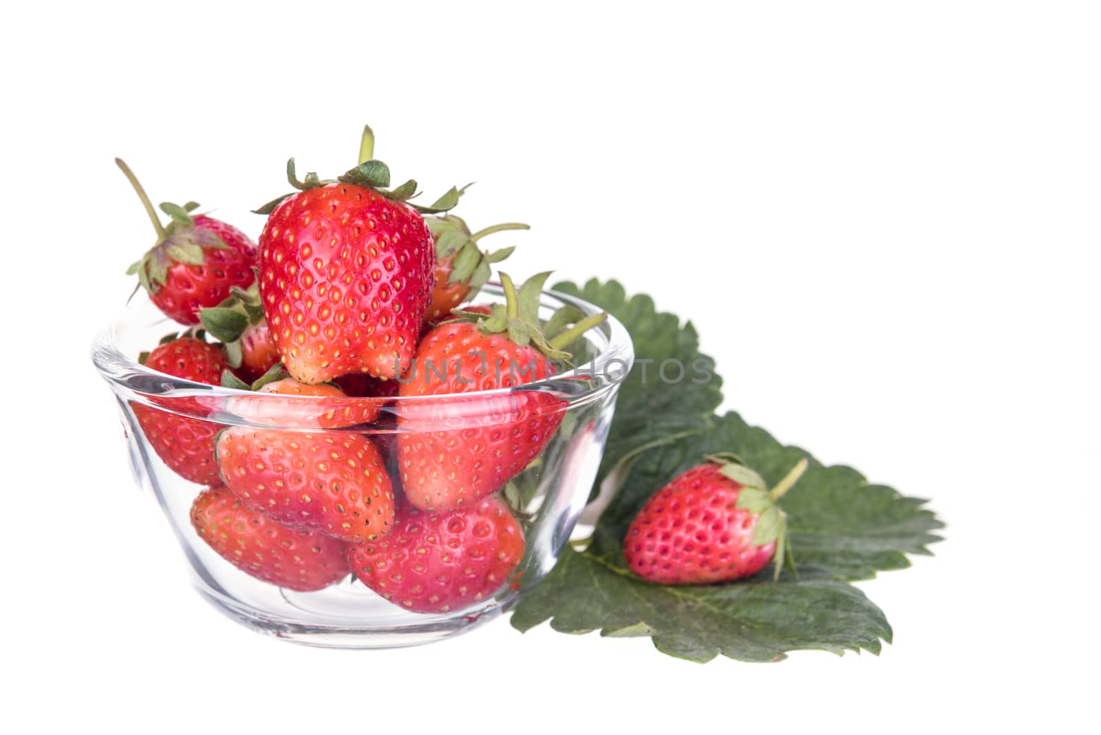 Strawberry in a glass. Isolated on white background