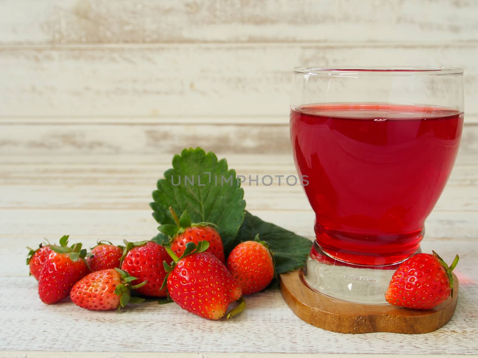 Strawberry Juice In the white wood background