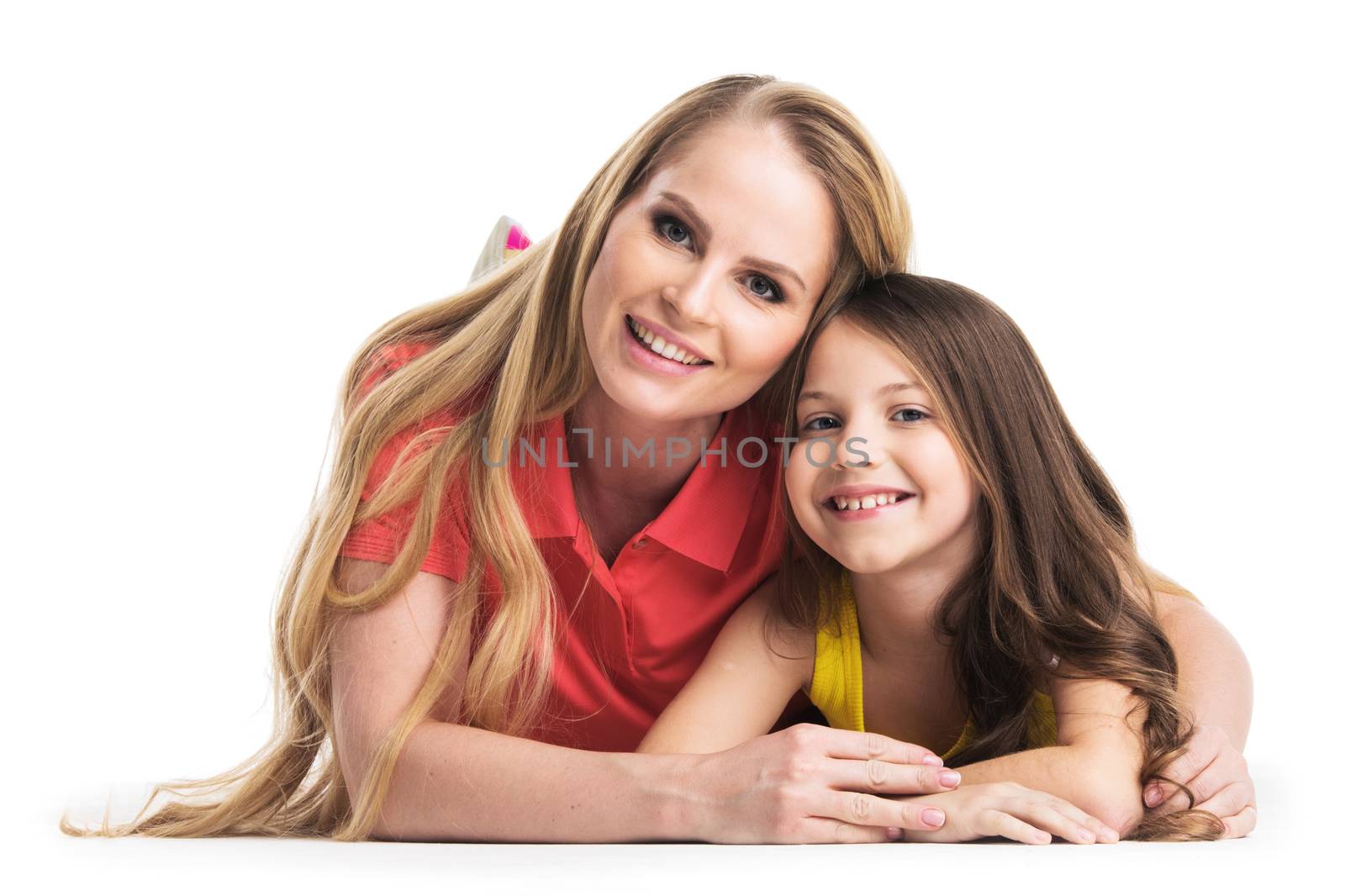 Mother and daughter lying on the floor isolated on white background