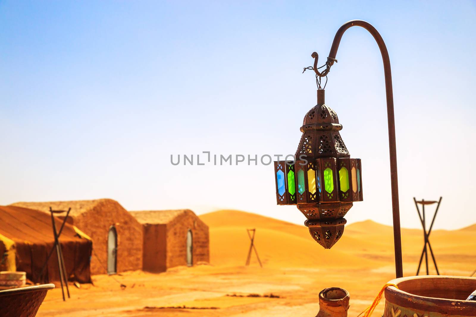 coloreful berber lamp with traditional nomad tents on background