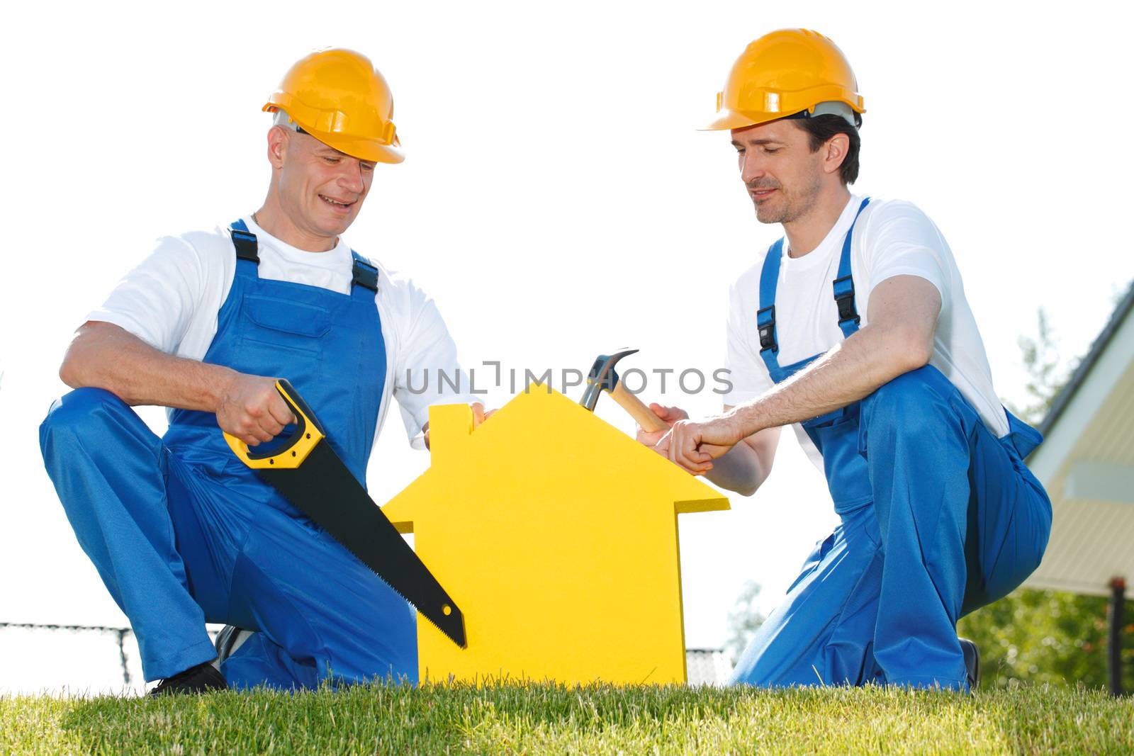 Workers with house model building construction concept