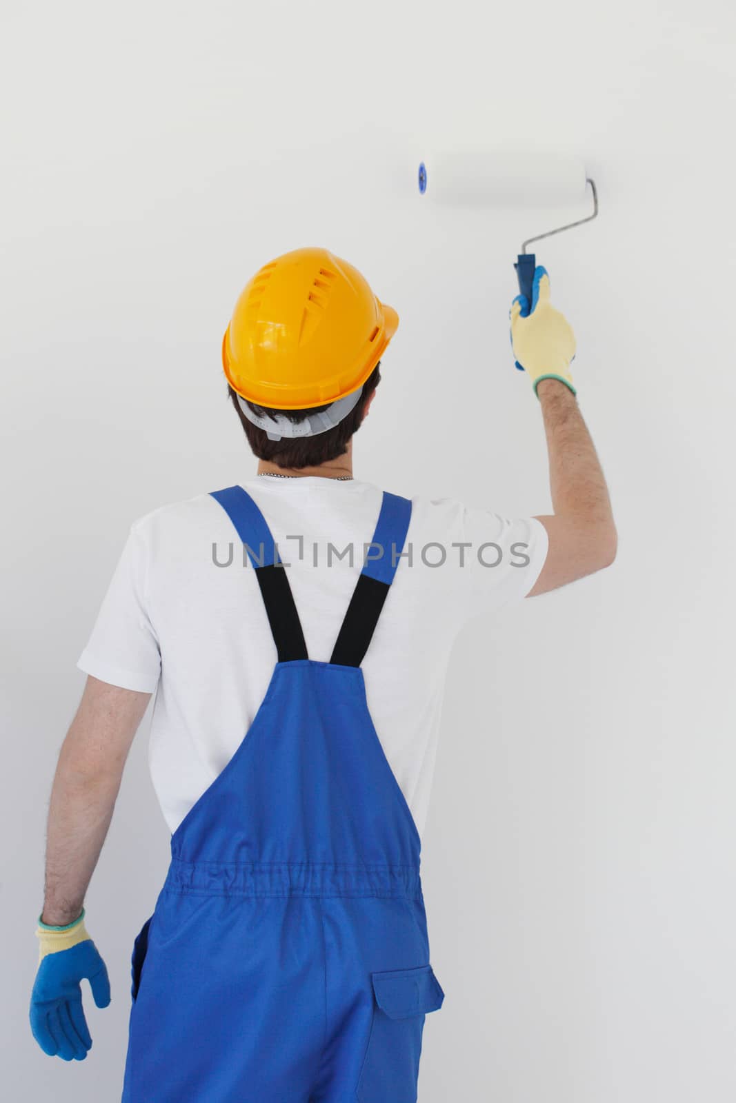 Worker painting wall by ALotOfPeople