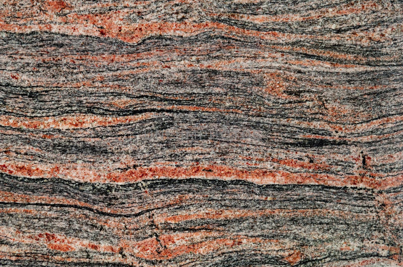 Polished magmatic or metamorphic rock cross section as background