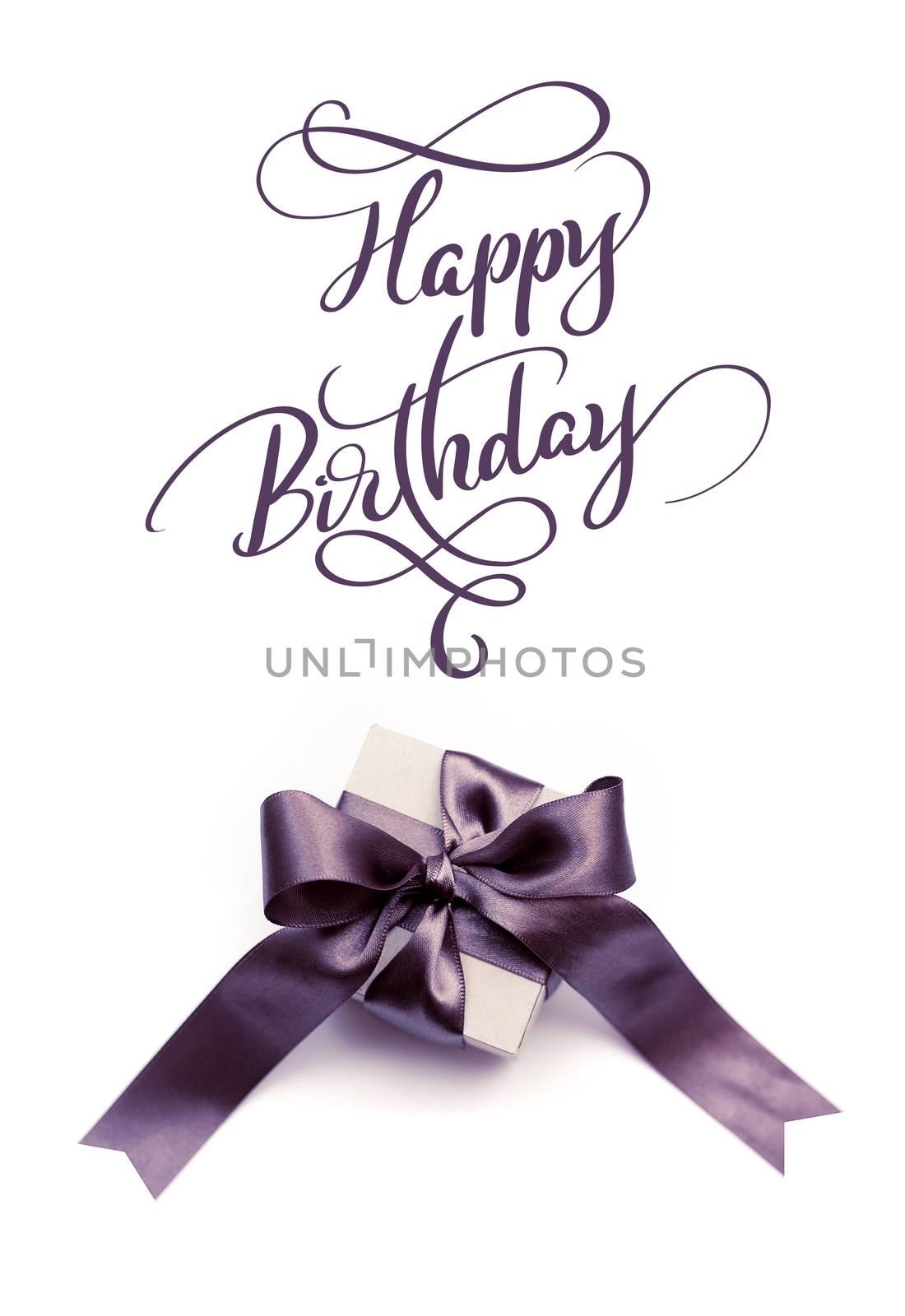 Gift box with brown bow on a white background and text Happy Birthday. Calligraphy lettering.