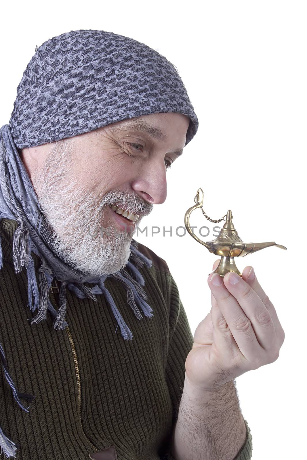 Arabic graying man with a lamp on a white background