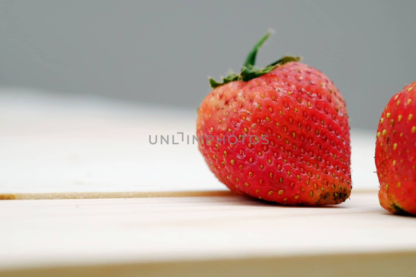 Close Up Red Strawberry on the Table Wood